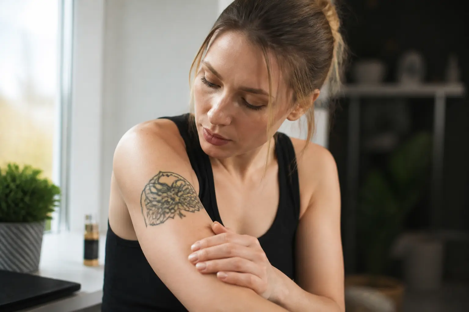 Supporting editorial photograph about reasons for tattoo removal