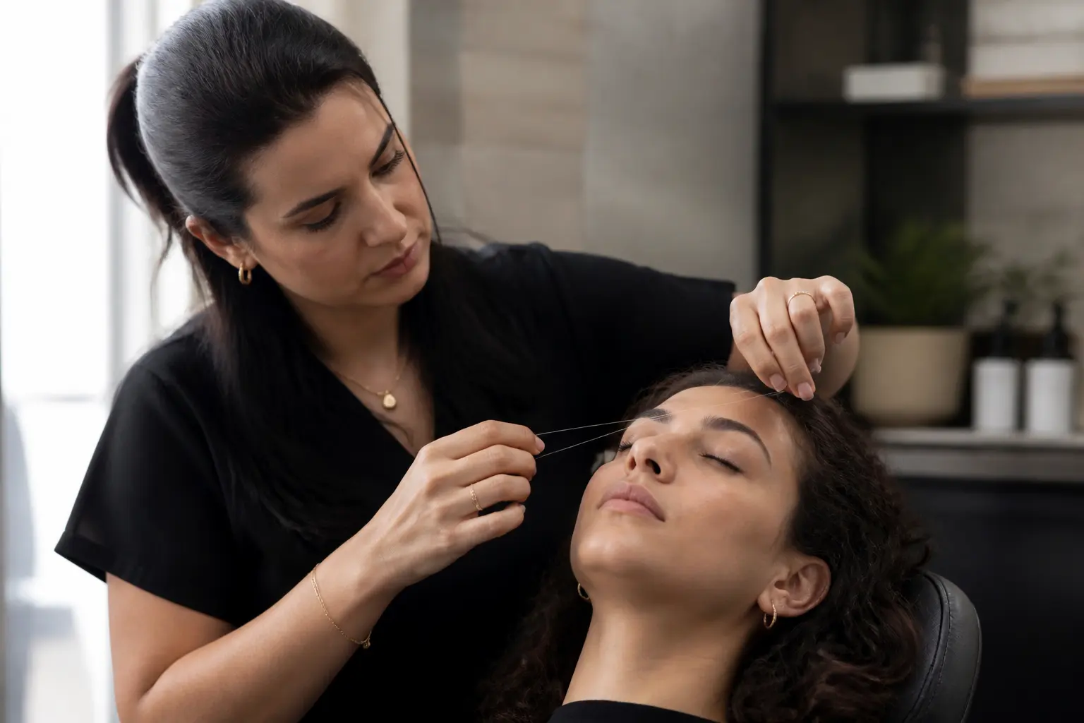 Supporting editorial photograph about threading for curly eyebrow hairs